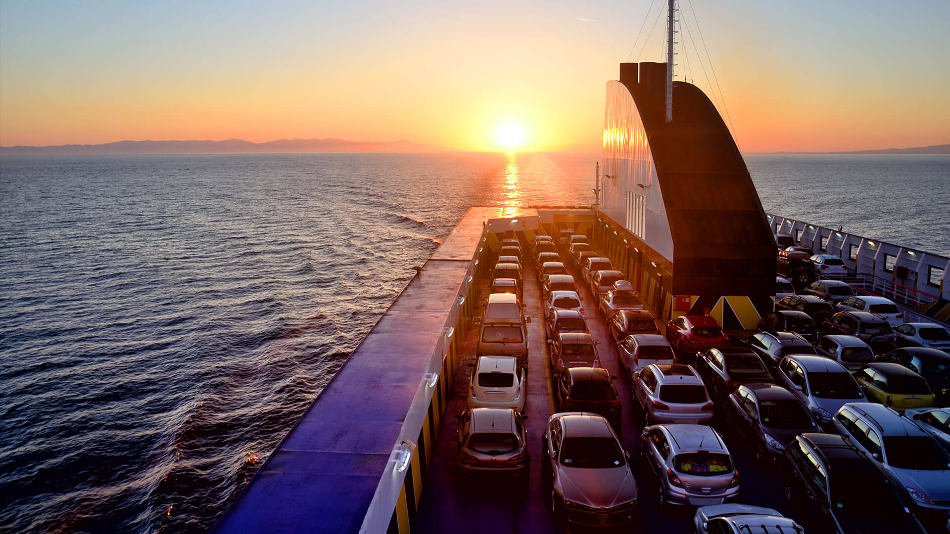 new cars arriving on-board a ship