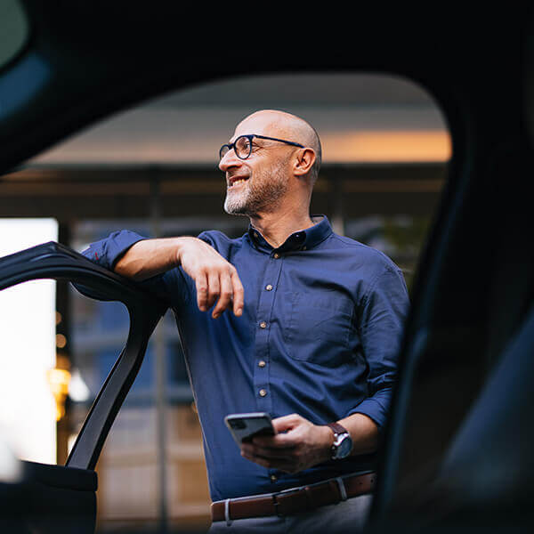Person standing by car door