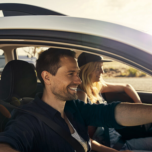 Couple driving in car